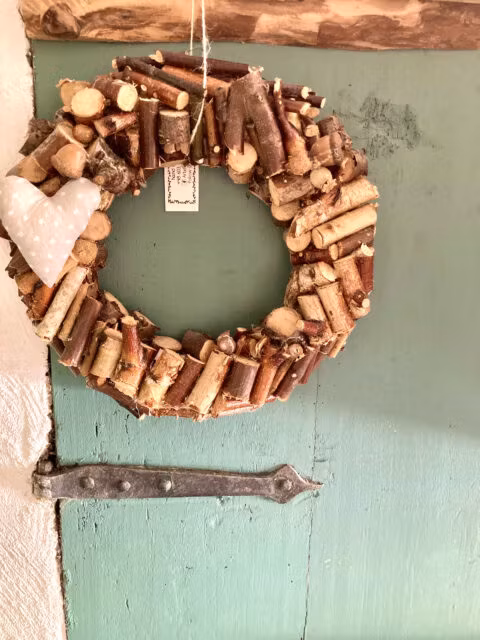 Rustic wreath on vintage wooden door